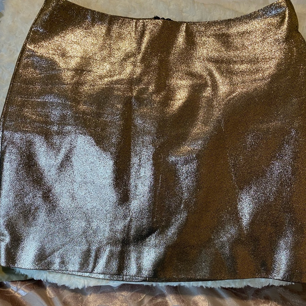 Gold mini skirt.